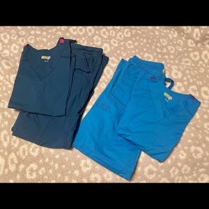 Two sets of women’s WonderWink Wonder Flex scrubs